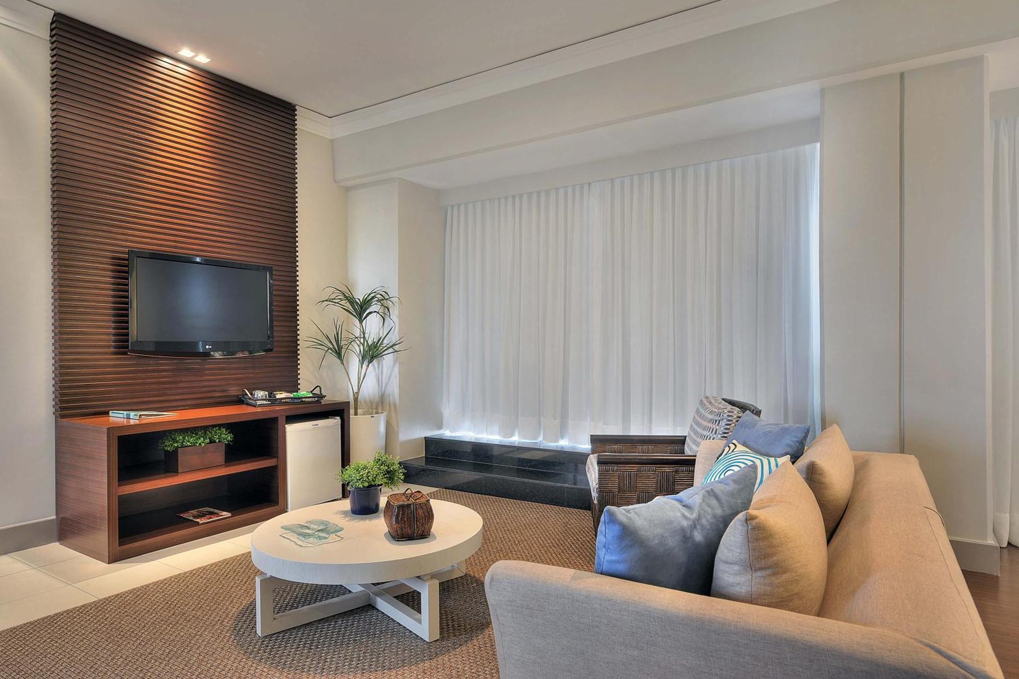 Hotel Deville Prime Салвадор Екстер'єр фото A living room with a television
